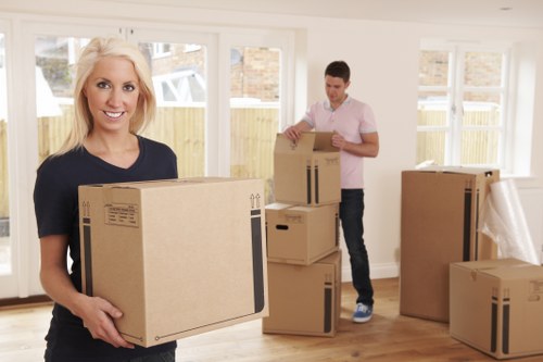 Movers handling household items during a relocation service