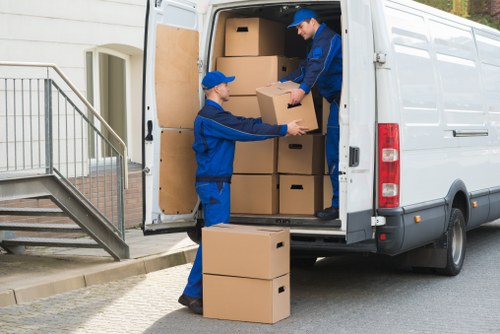 Student removals team helping with boxes and furniture in Balham