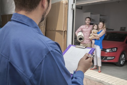 Local movers carrying student furniture from a Balham flat
