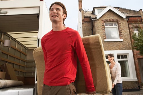 Supervisor overseeing safe loading procedures during a house move