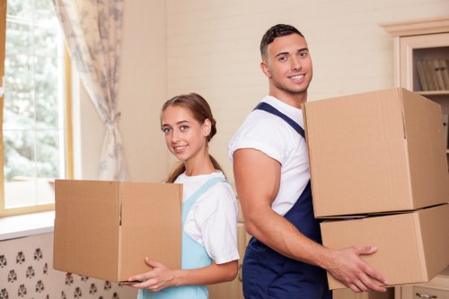 Professional movers loading household items for a Balham property move