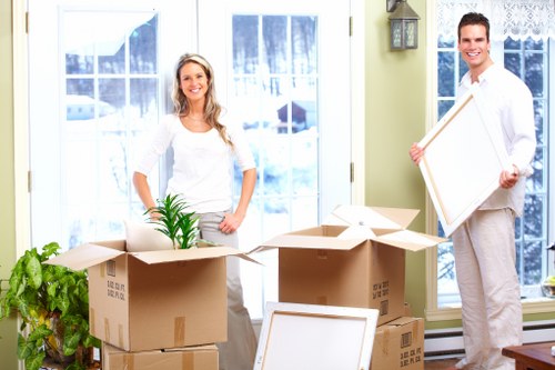Moving team loading furniture and boxes into a van